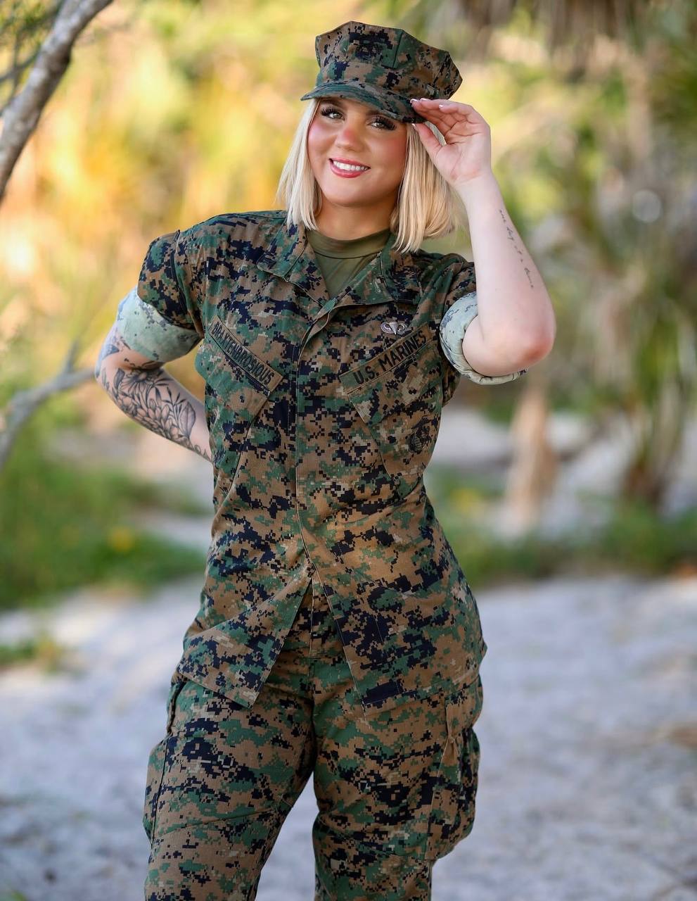 Charlie in USMC woodland cammies saluting